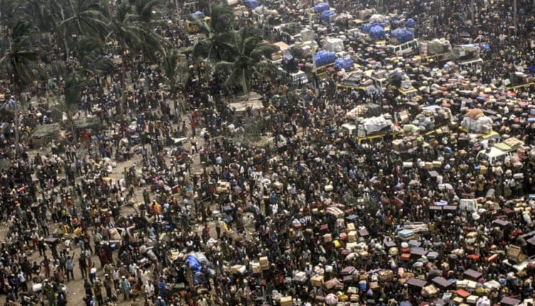 Caught between legality and diplomacy: Pathetic story of Nigerian traders in Ghana 14 Aerial view of the Benin Nigeria border as expelled Ghanaians wait to leave Nigeria Photo by Michel Setboum Getty Images 750x430 1