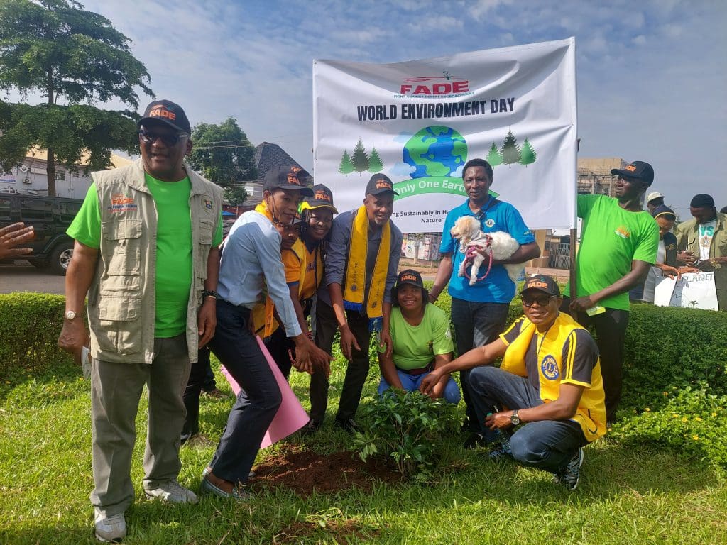 Lions Club group planting tree. 1 1