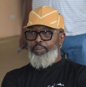 DJBola Browne, Freedom Park’s Director of Progs, buried in colours 38 Pensive Raybee