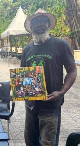 DJBola Browne, Freedom Park’s Director of Progs, buried in colours 52 Raybee with Femi Kuti album
